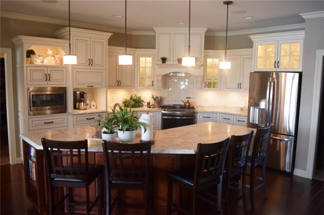 Painted & glazed perimeter cabinets - Hickory island cabinets with cherry stain - Laminate countertops